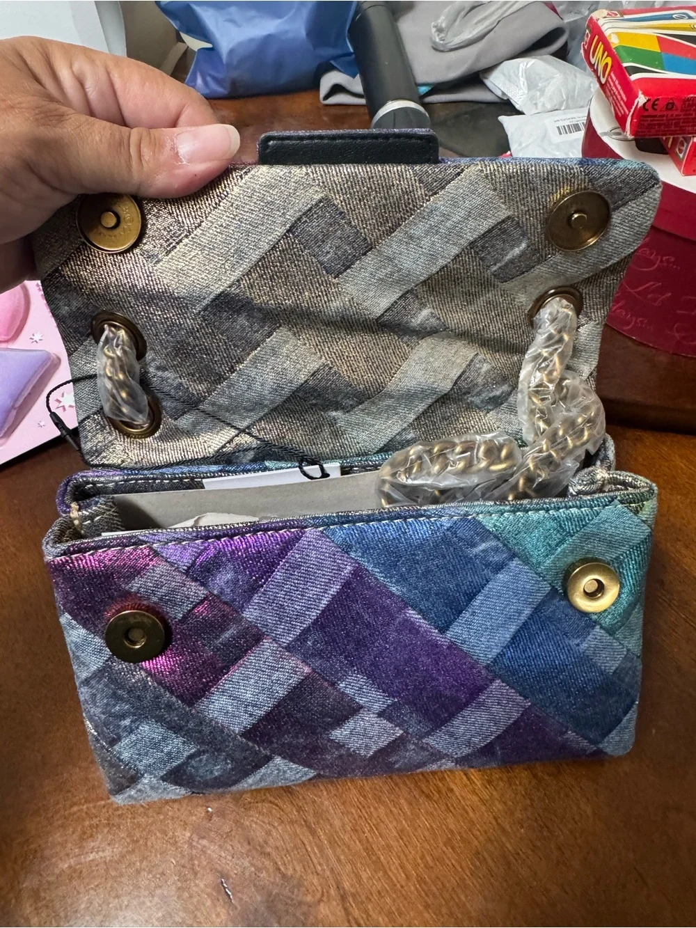 Kurt Geiger London Mini Kensington Soft Bag features a colorful patchwork denim